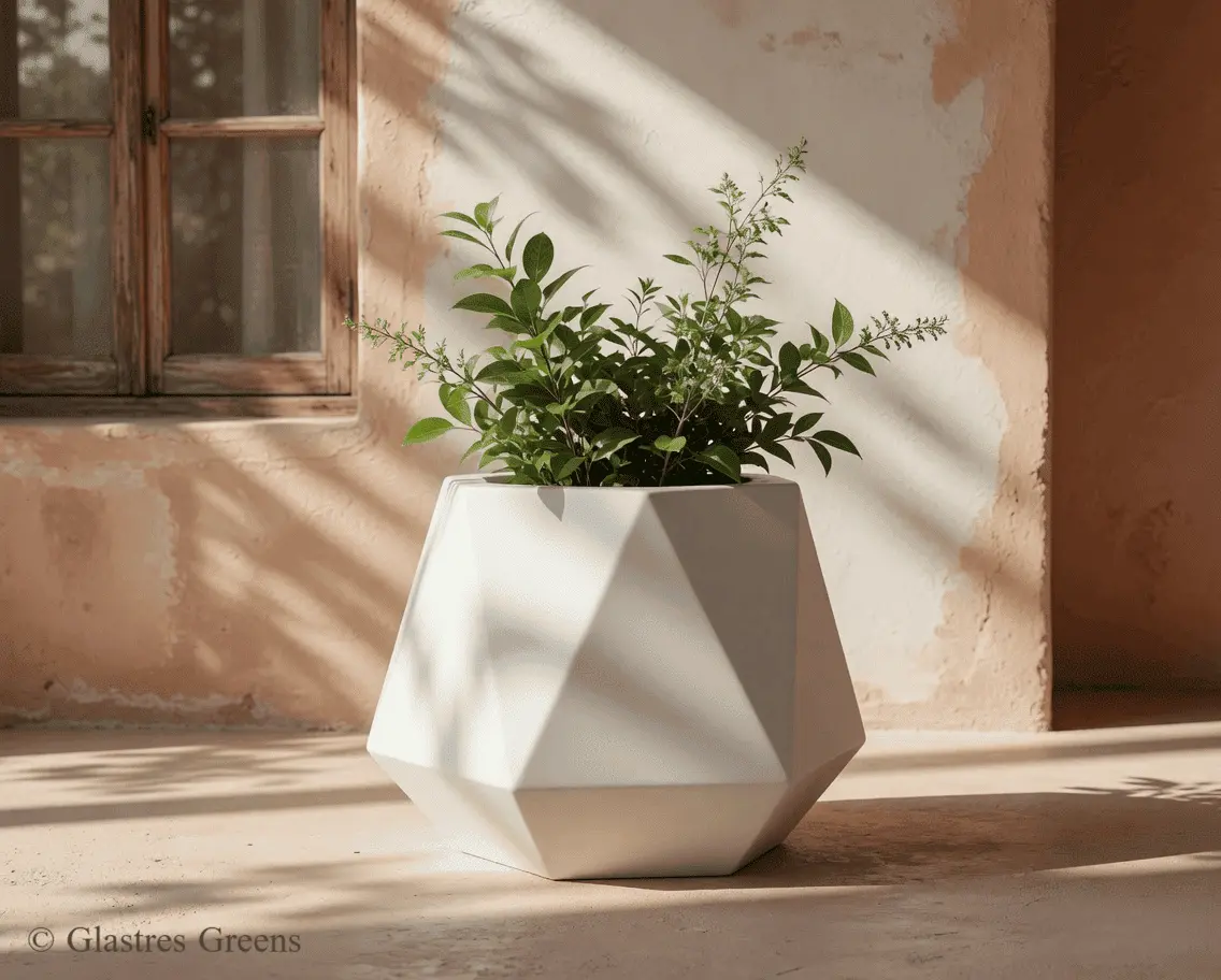 A commercial fiberglass planter positioned outside a high-end retail storefront, curating an inviting and premium visual aesthetic for potential shoppers.