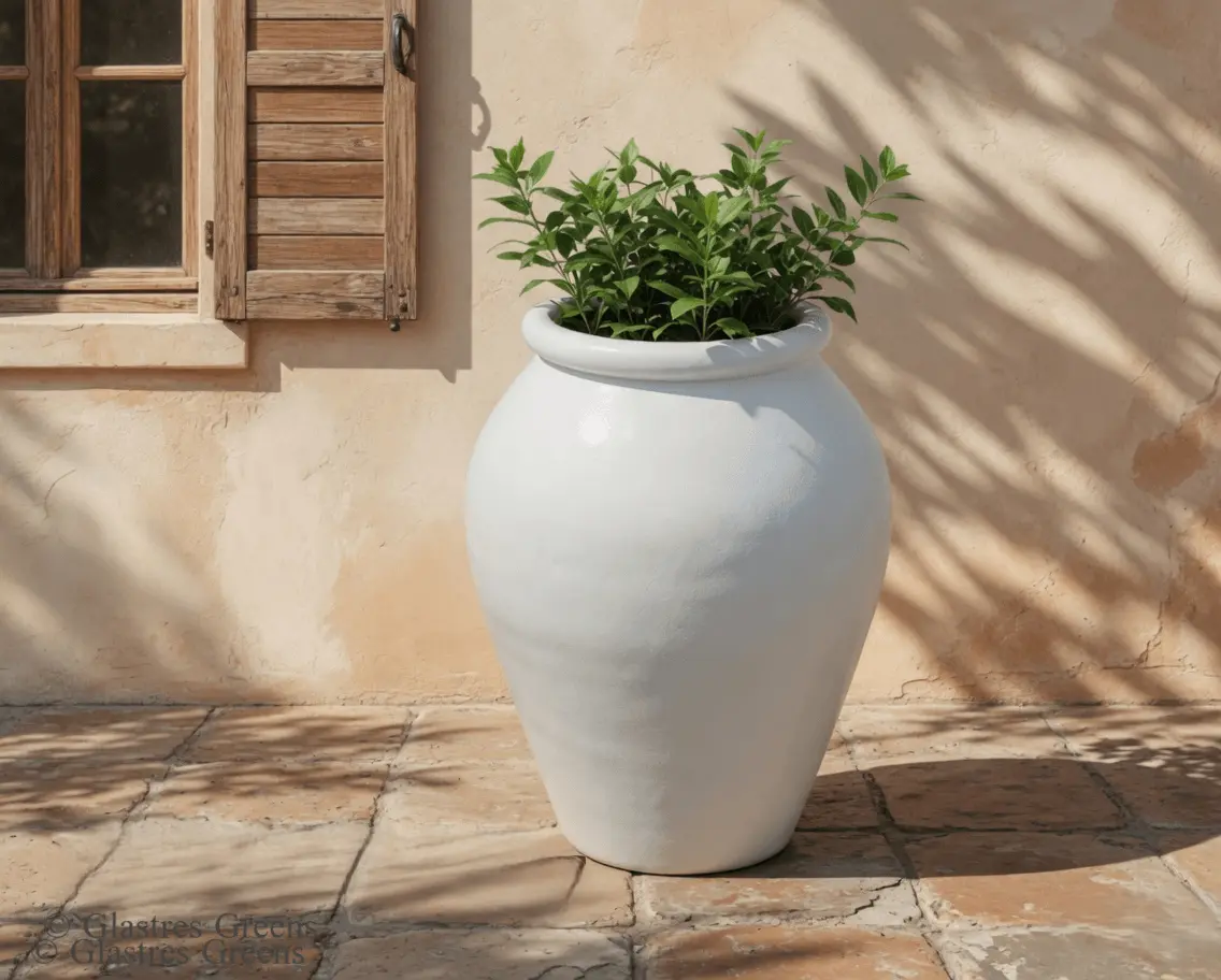 A premium tall fiberglass planter enriching a corporate lobby environment, presenting a polished, professional container for interior architectural plants.