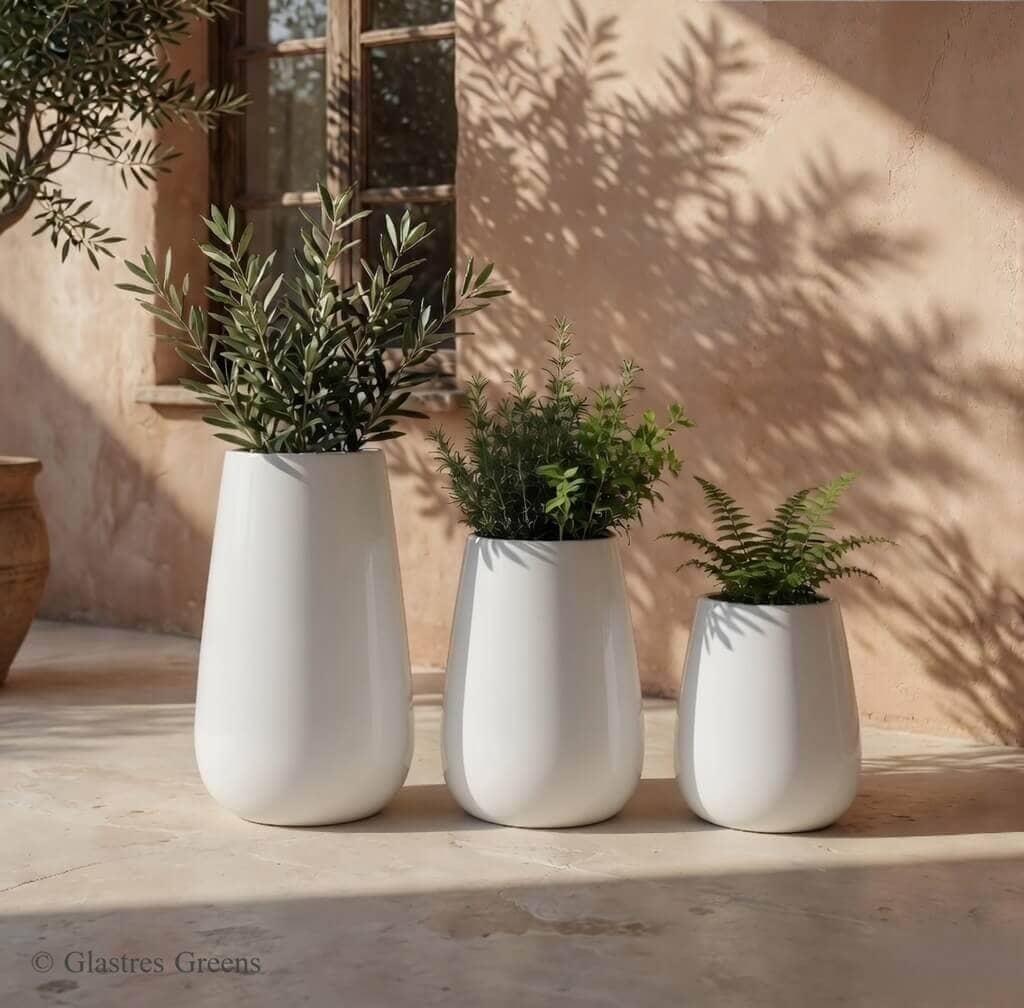Aster tall indoor fiberglass planter engineered with refined vertical proportions, elevating the aesthetic of corporate offices and luxury interiors.