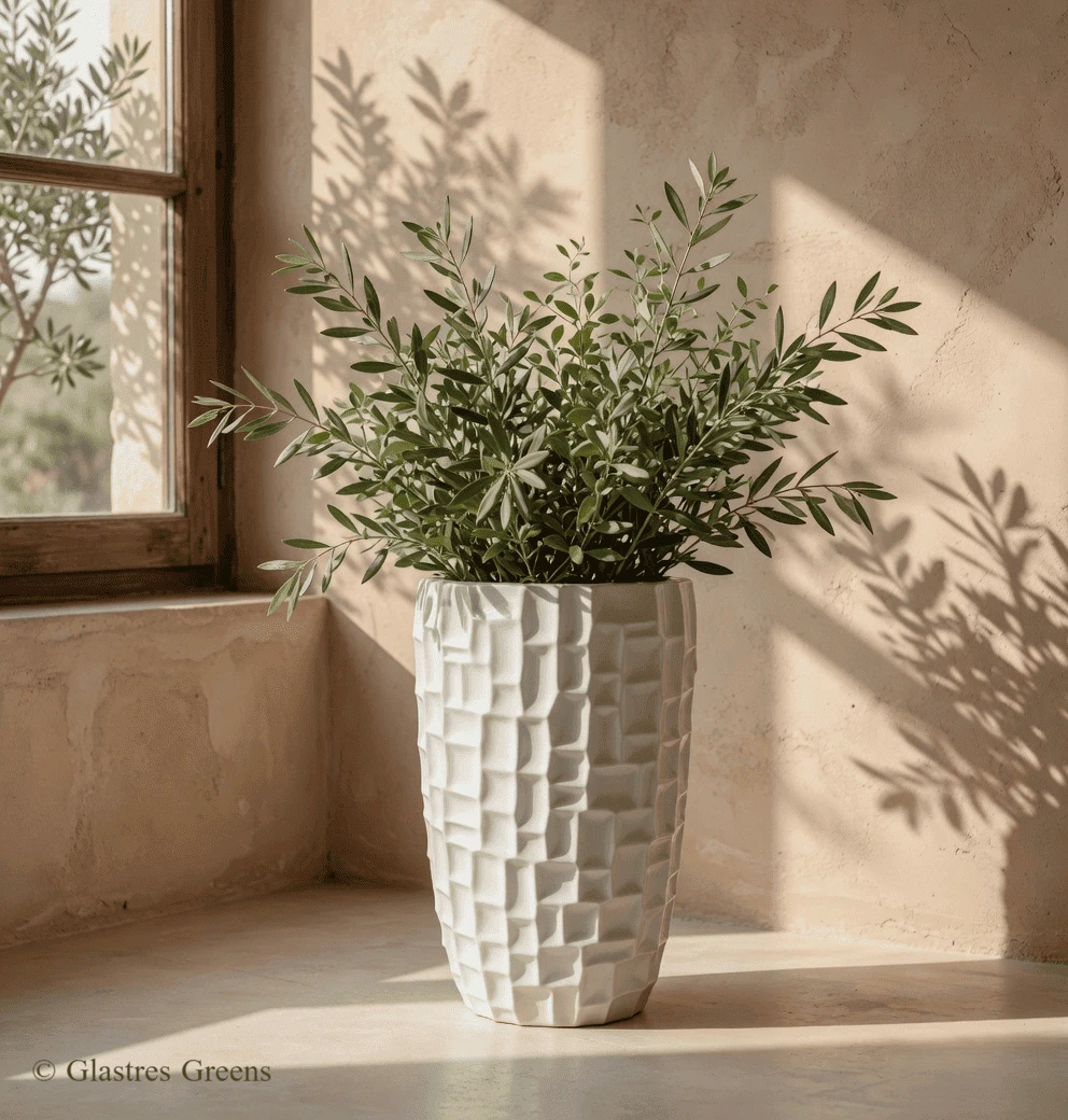 Galaxy modern geometric FRP planter combining a faceted, space-age surface with heavy-duty construction for contemporary luxury architectural spaces.
