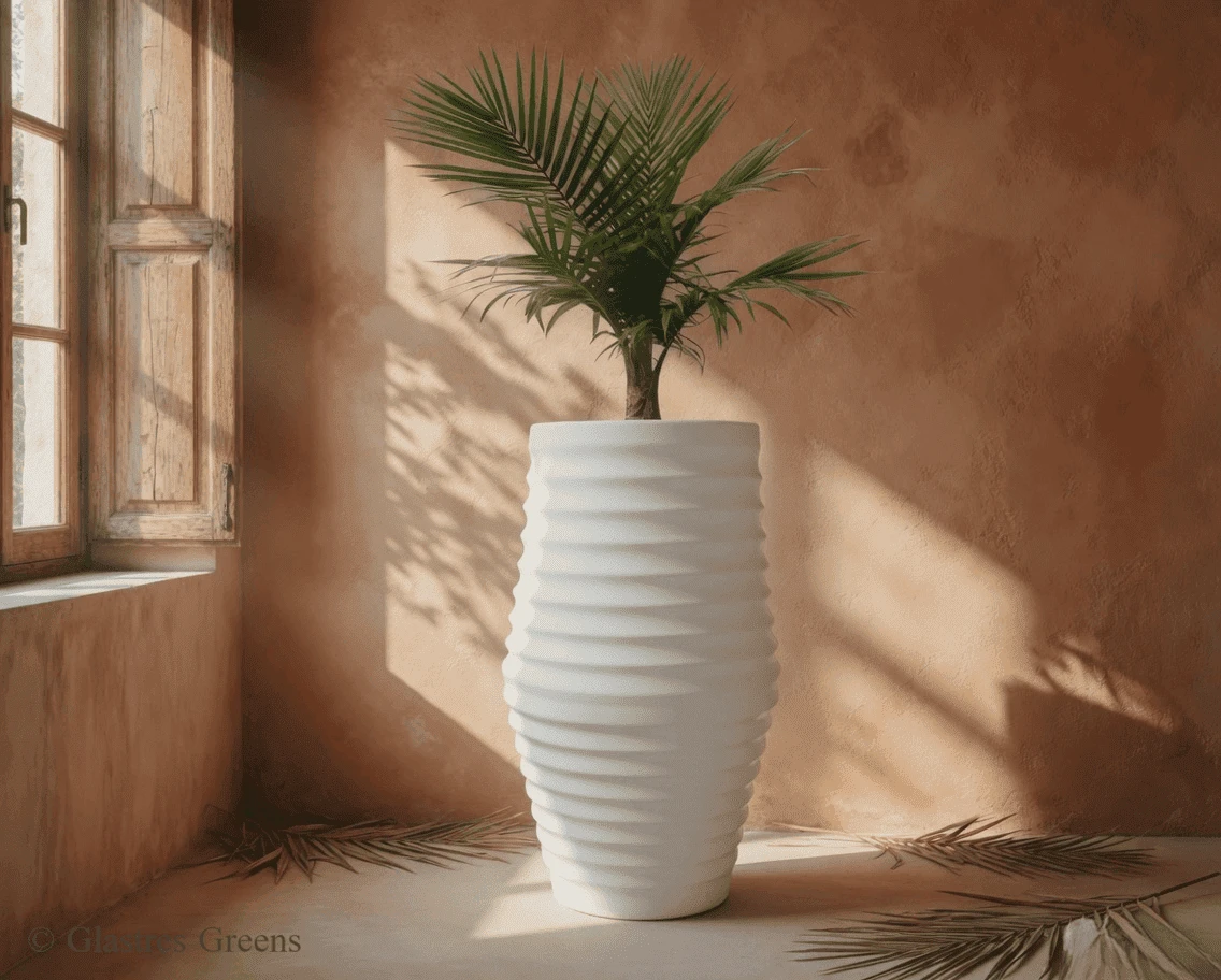Pheonix tall outdoor fiberglass planter creating a bold, statuesque sculptural presence that survives extreme weather in villa and resort landscaping.
