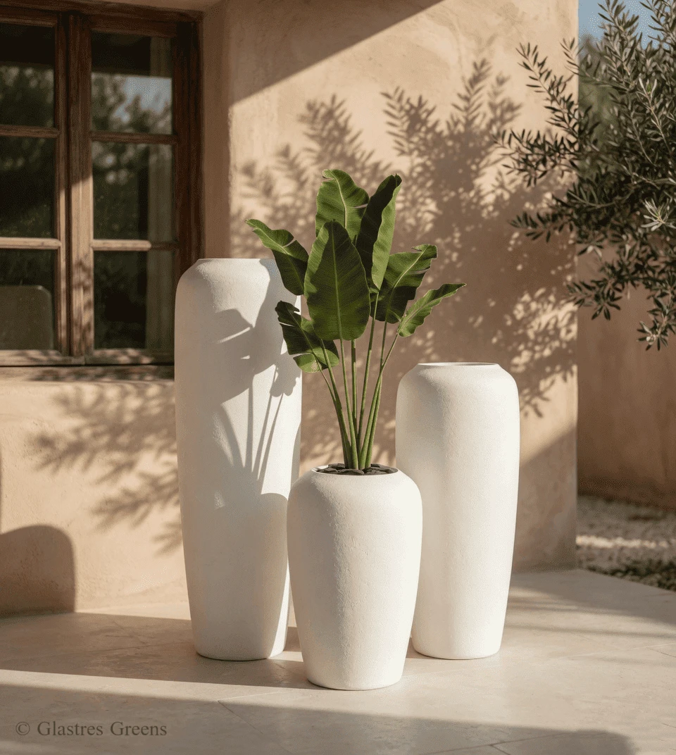 Tall architectural FRP planter demonstrating vertical scale and wind load considerations